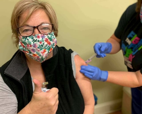 Woman getting COVID vaccine